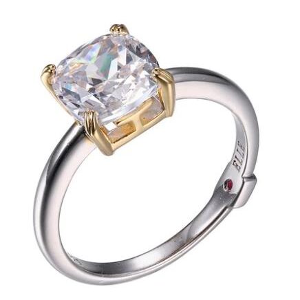 Elegant two-tone ring with a large square-cut clear gemstone.