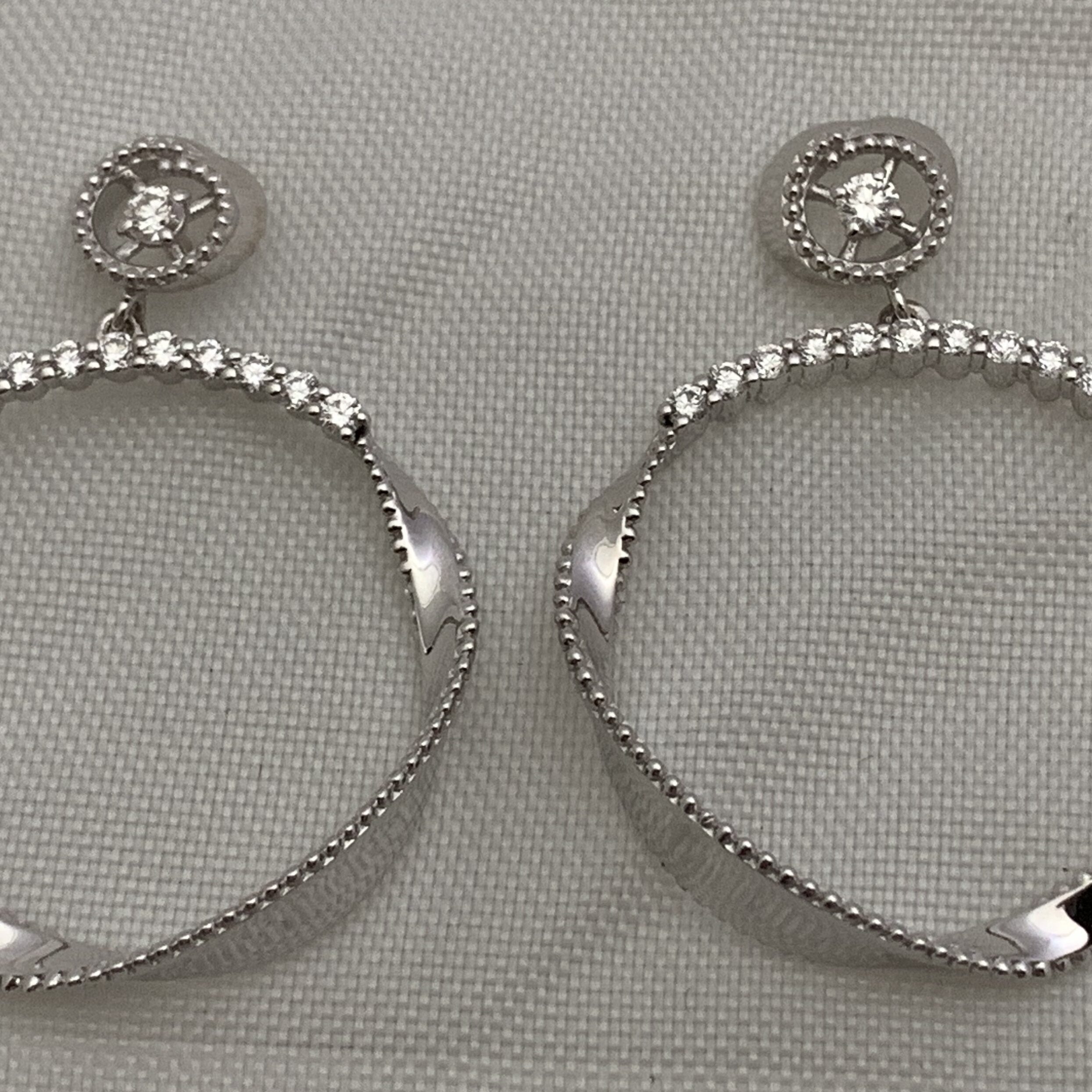 Elegant silver hoop earrings with rhinestone accents.