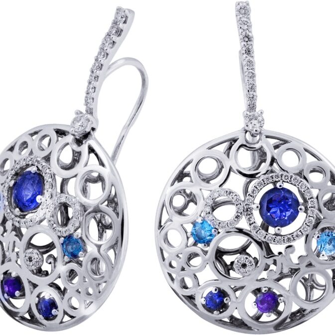 Elegant silver earrings with blue and purple gemstones in a circular design.
