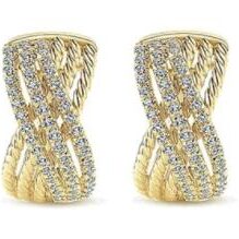 Elegant gold and diamond twisted hoop earrings.