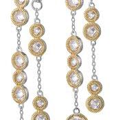 Elegant pearl and gold bead necklace with a delicate chain.