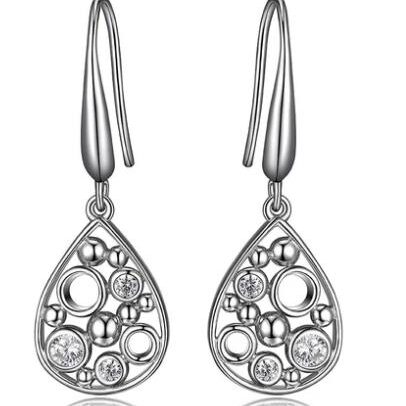 Elegant silver teardrop earrings with intricate openwork design.