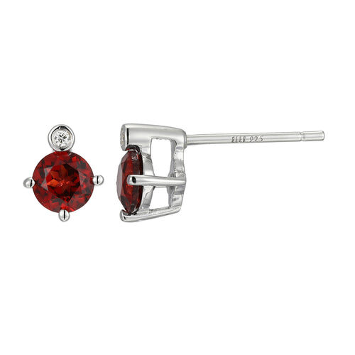 Elegant silver stud earring with a deep red gemstone.