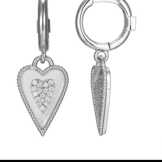 Silver heart and spike earrings with detailed designs.