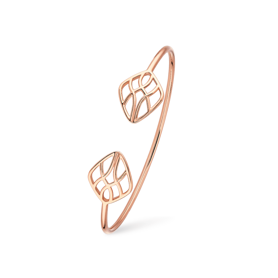 Elegant rose gold bracelet with intricate leaf design.
