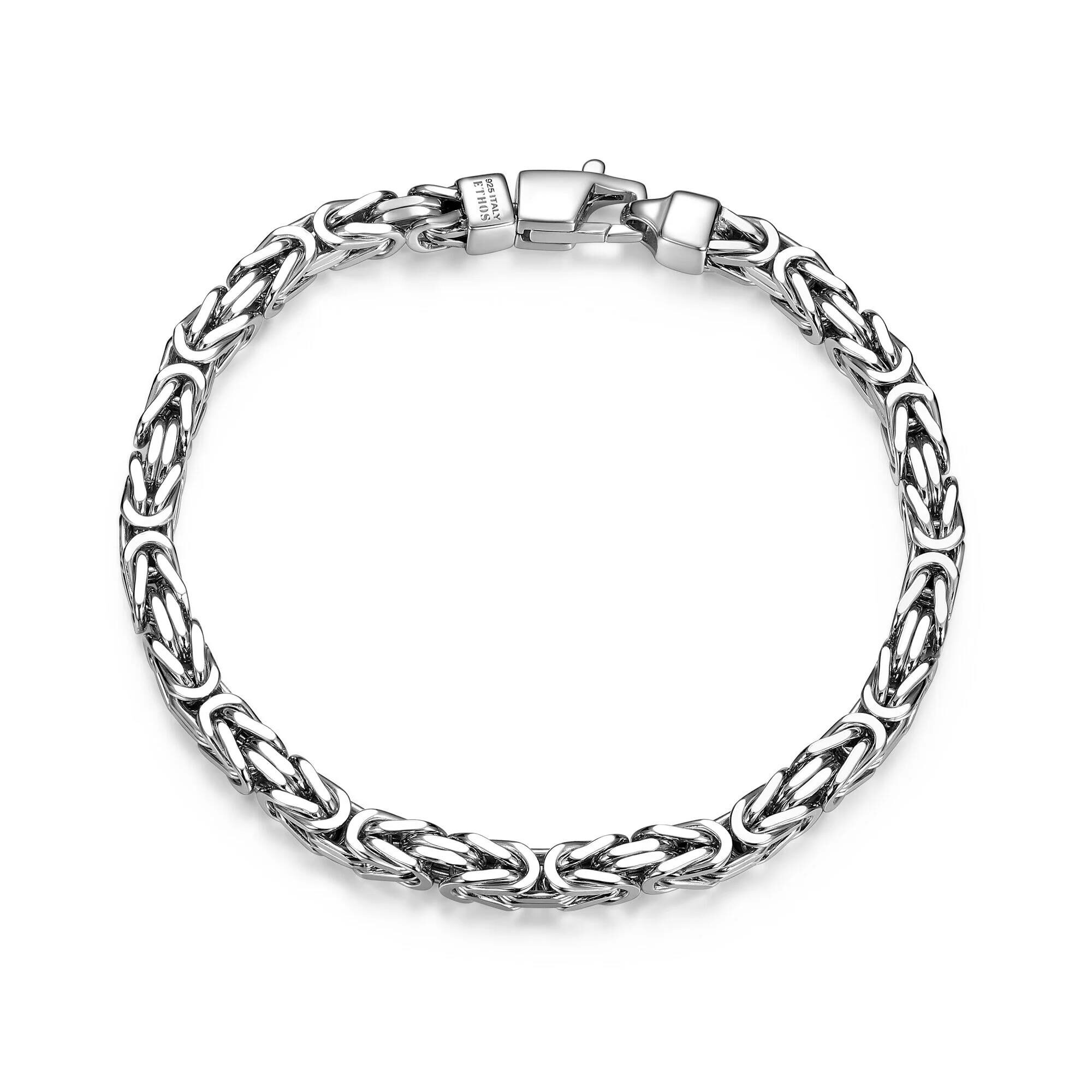 Intricately designed silver chain bracelet with a secure clasp.