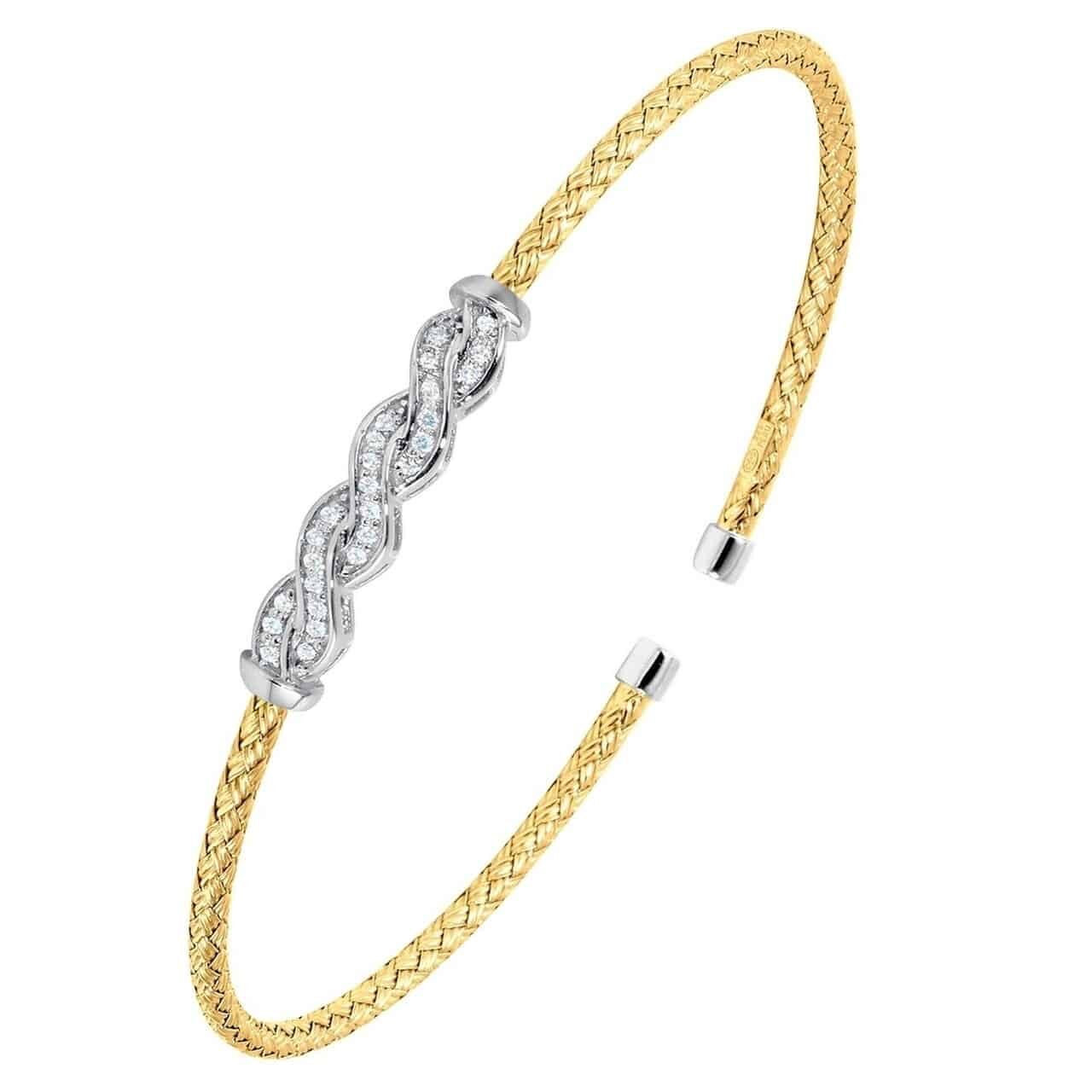 Elegant gold and silver bracelet with intricate design.