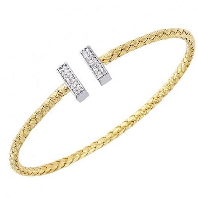Elegant gold bracelet with diamond accents on open ends.
