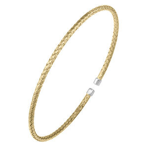 Elegant gold bangle bracelet with a subtle clasp.