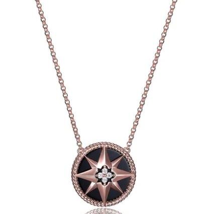 Elegant round pendant necklace with star design and central gemstone.