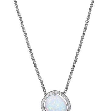 Elegant silver necklace with a round moonstone pendant.