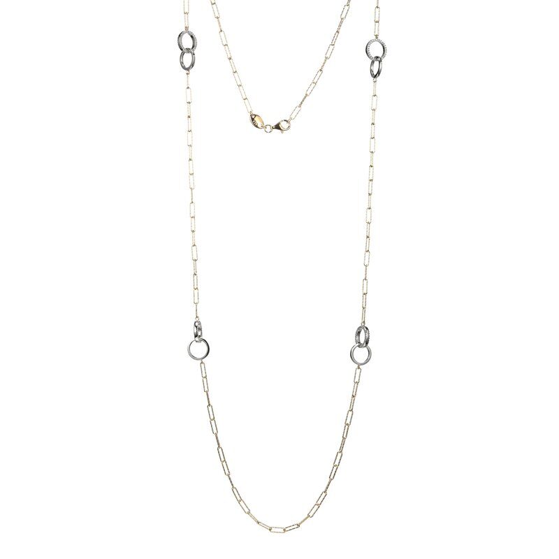 Elegant silver chain necklace with delicate links and small circular accents.
