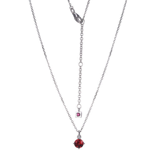 Elegant silver necklace with two red gemstone pendants.
