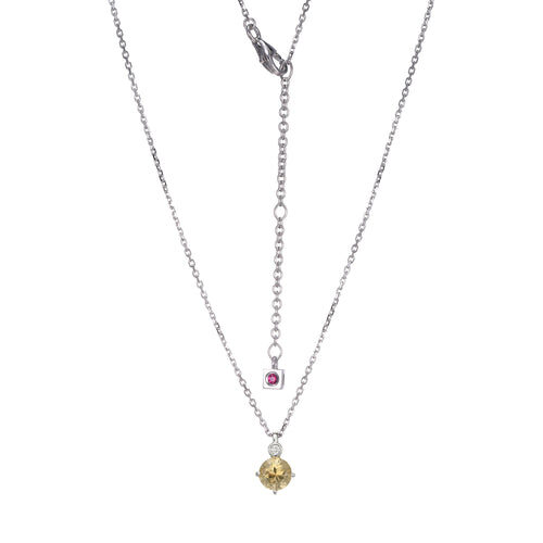 Delicate double-layer necklace with pink and yellow charms.