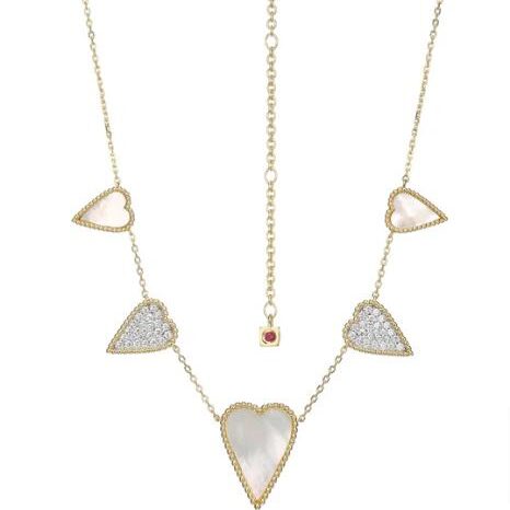 Delicate gold necklace with heart-shaped pendants in white and gold.