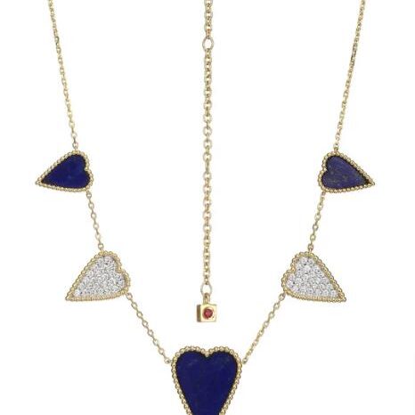 Gold necklace with blue and white heart-shaped pendants.