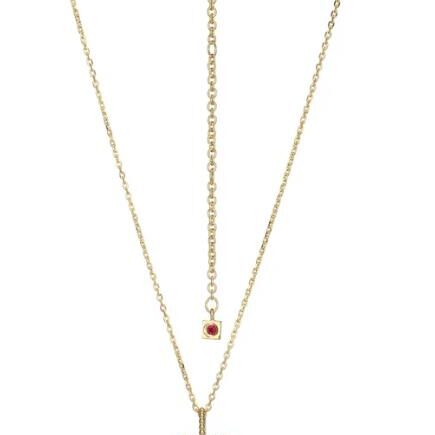 Delicate gold necklace with a small pendant and adjustable chain.