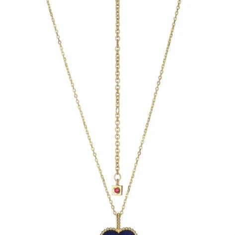 Elegant gold necklace with a clover-shaped pendant.