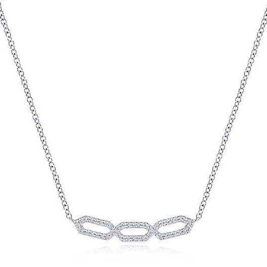 Elegant silver necklace with three linked hexagonal pendants.