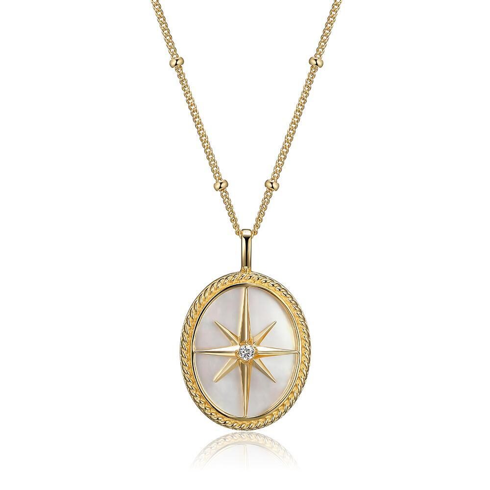 Elegant gold necklace with a compass rose pendant.