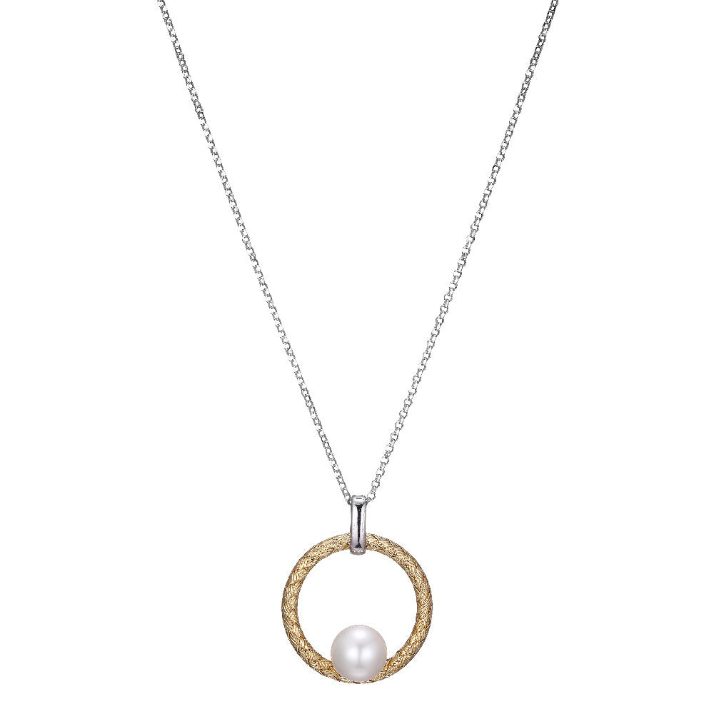 Elegant necklace with a circular pendant and two pearls.