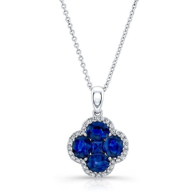 Elegant silver necklace with a blue sapphire and diamond pendant.