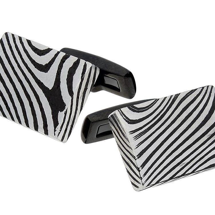 Rectangular cufflinks with bold zebra stripe patterns.