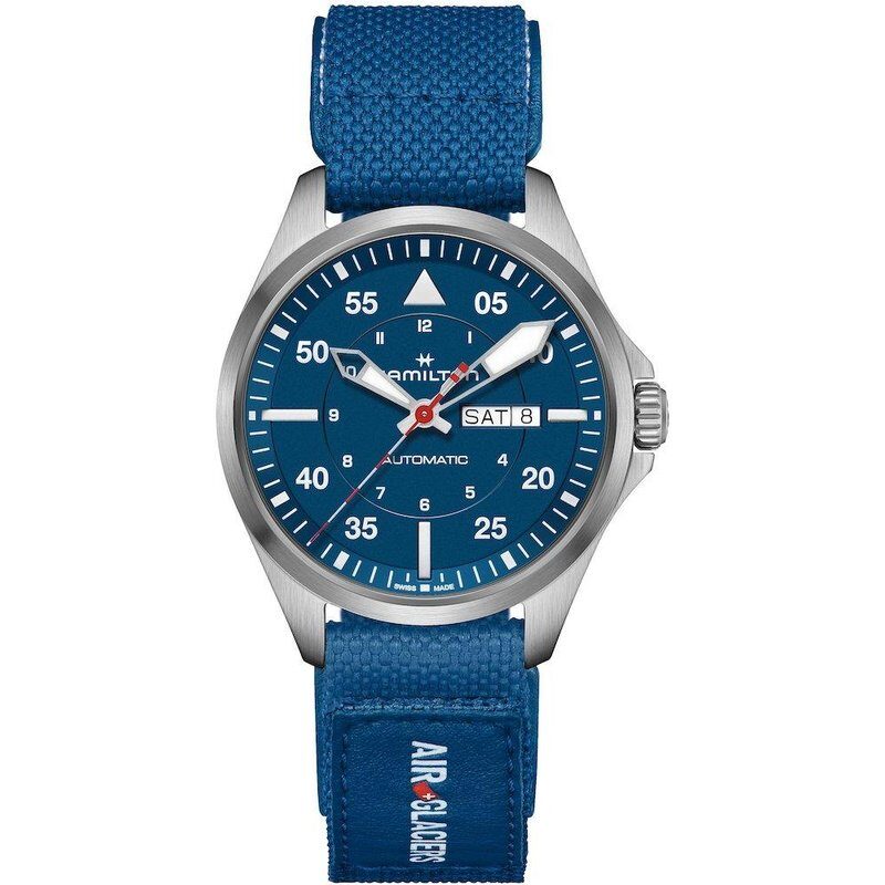 Blue wristwatch with a fabric strap and day-date display.