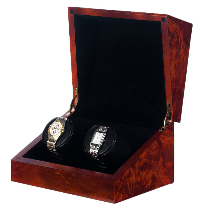 Elegant wooden box holding two luxury watches.