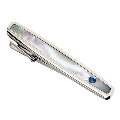 Elegant mother-of-pearl tie clip with a blue gemstone accent.