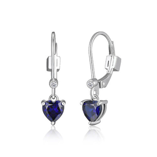 Elegant silver earrings with heart-shaped blue gemstones and small clear accents.