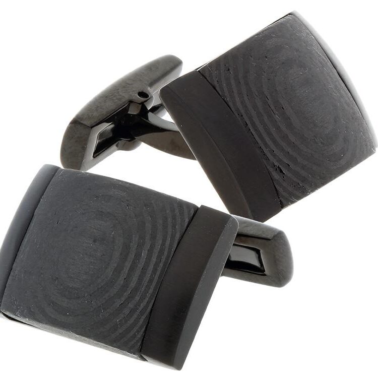 Black square cufflinks with a textured pattern and metal backing.