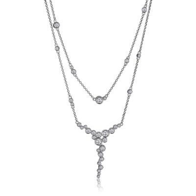 Elegant layered silver necklace with diamond accents.