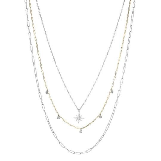 Elegant layered silver necklace with small star-shaped pendants.