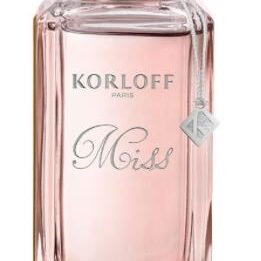 Elegant pink Korloff Mist perfume bottle with silver accents.