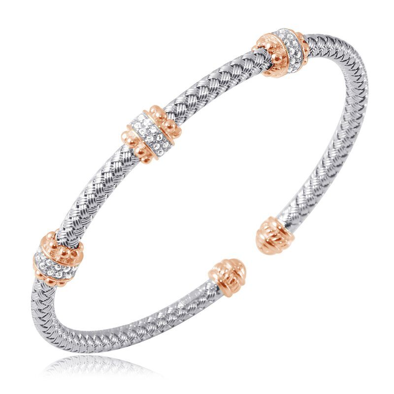 Elegant silver and rose gold bracelet with intricate detailing.