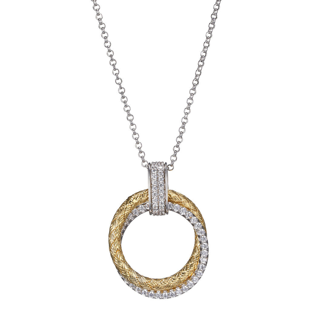 Elegant gold and silver circular pendant necklace with a delicate chain.