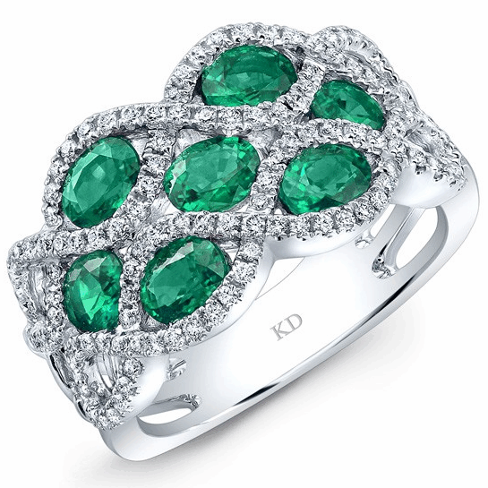Elegant silver ring adorned with multiple green emeralds and diamonds.